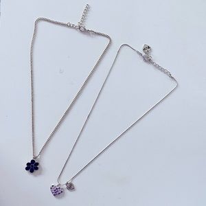 Lot of 2 Y2K silver toned costume jewelry pendant necklaces (heart & flower)